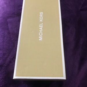 Michael Kors logo slides